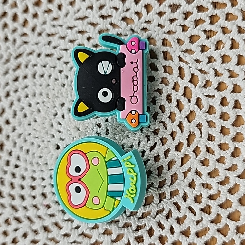 Sanrio Characters crock charms set of 2. New